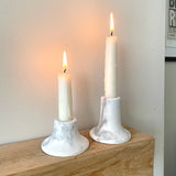 a set of 2 marble candlestick holders. different height taper candle holders made from concrete