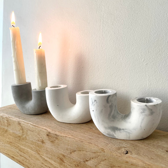 double candlestick holders. U shaped candle holder available in grey, white and marble
