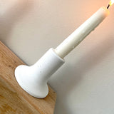 tall white candlestick holder