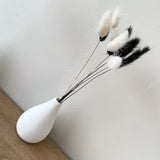 white concrete bud vase with monochrome bunny tails